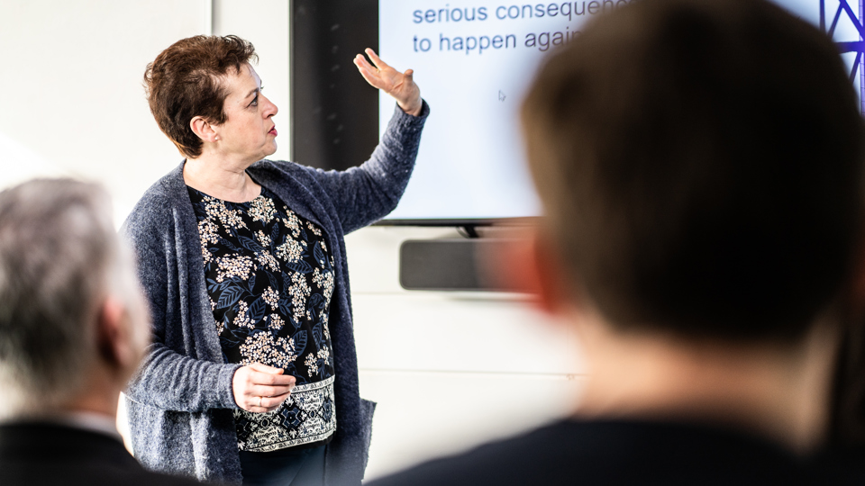 woman delivering training course