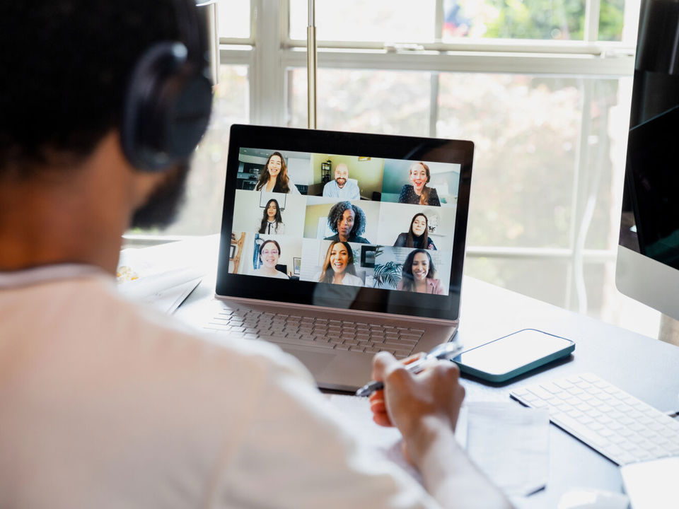 Man in group chat on laptop